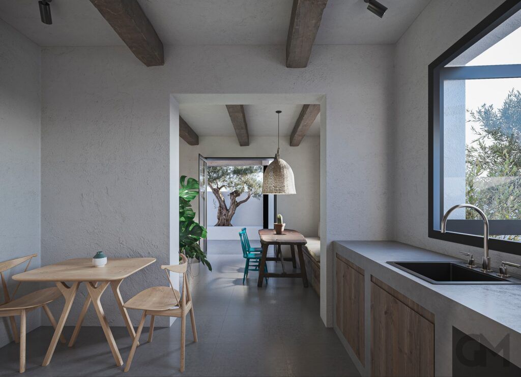 Una cocina con una mesa y sillas y un fregadero.