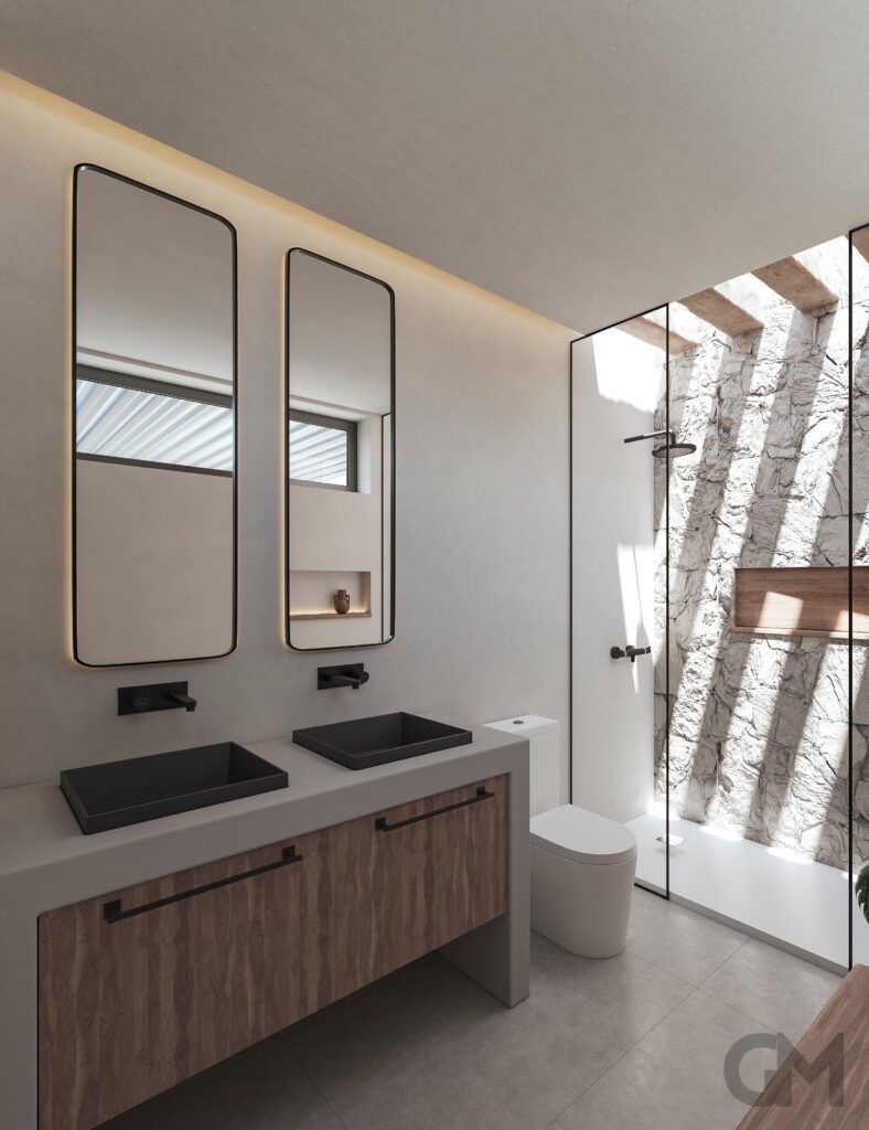 Un baño con dos lavabos y dos espejos.