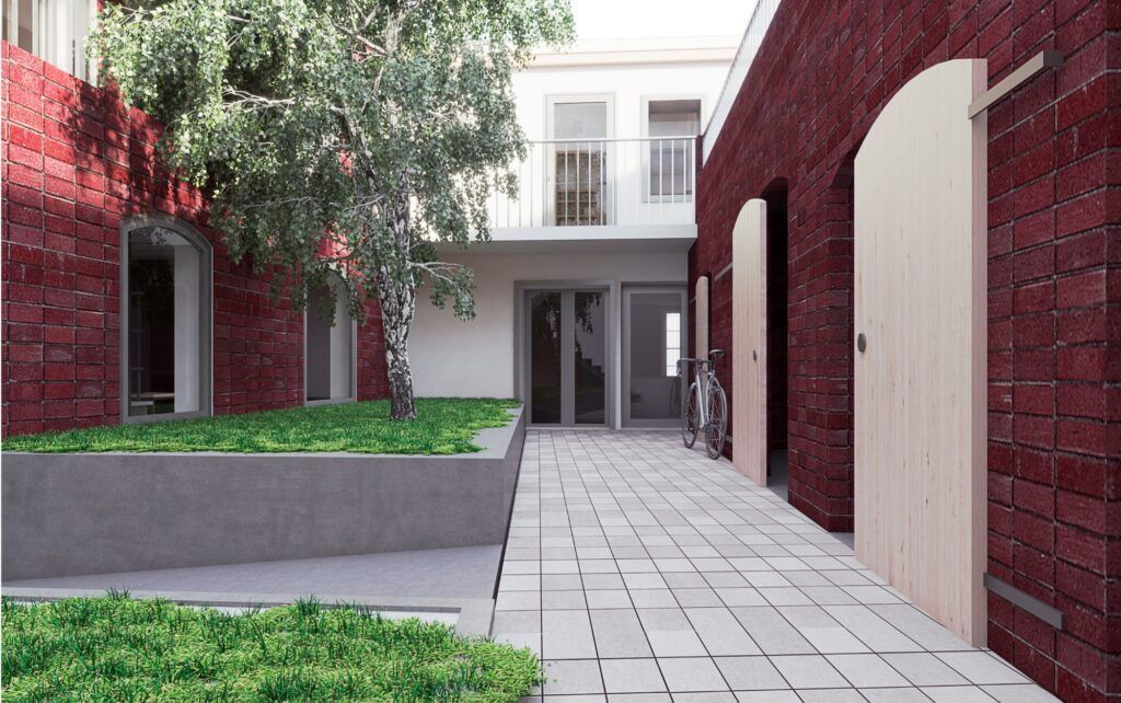 Impresión artística de un patio entre dos edificios.