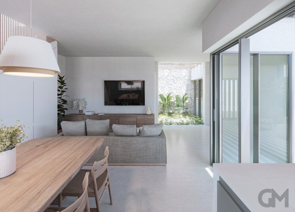 Espacio de estar de concepto abierto con mesa de comedor, sofá, TV y puertas corredizas de vidrio a un patio.