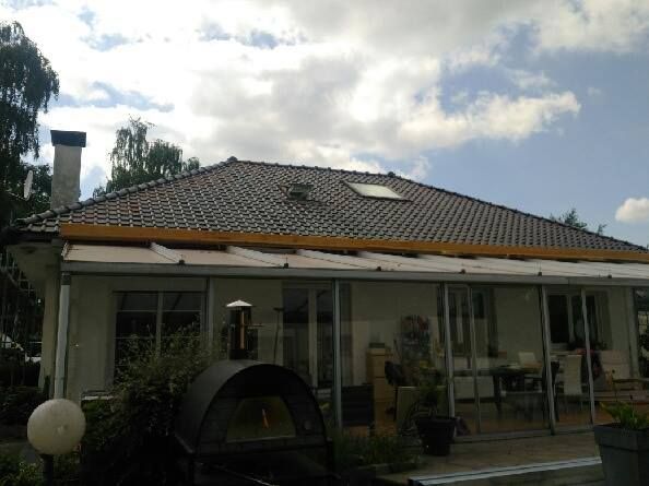 Rénovation de la toiture et de l'étanchéité d'une maison avec véranda