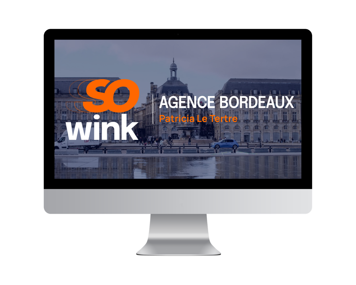 Un écran d'ordinateur affichant une diapositive de présentation pour l'agence « So Wink » à Bordeaux, avec une vue de la ville en arrière-plan.