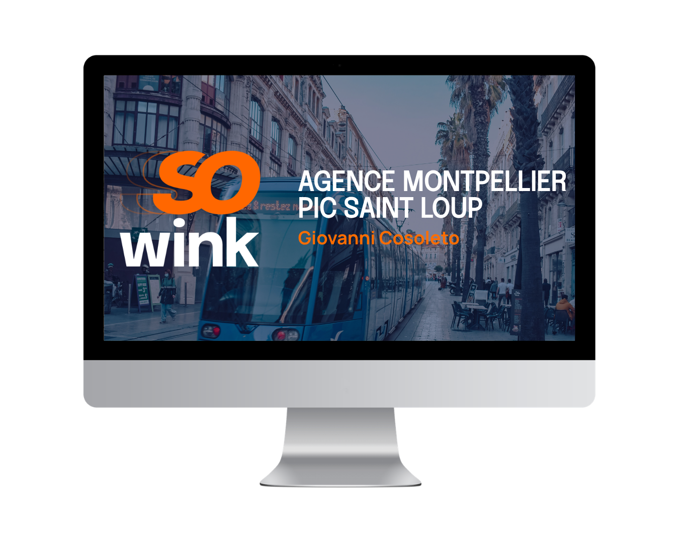 Écran d'ordinateur affichant le logo SoWink et la mention « Agence Montpellier Pic Saint Loup » sur fond de rue.