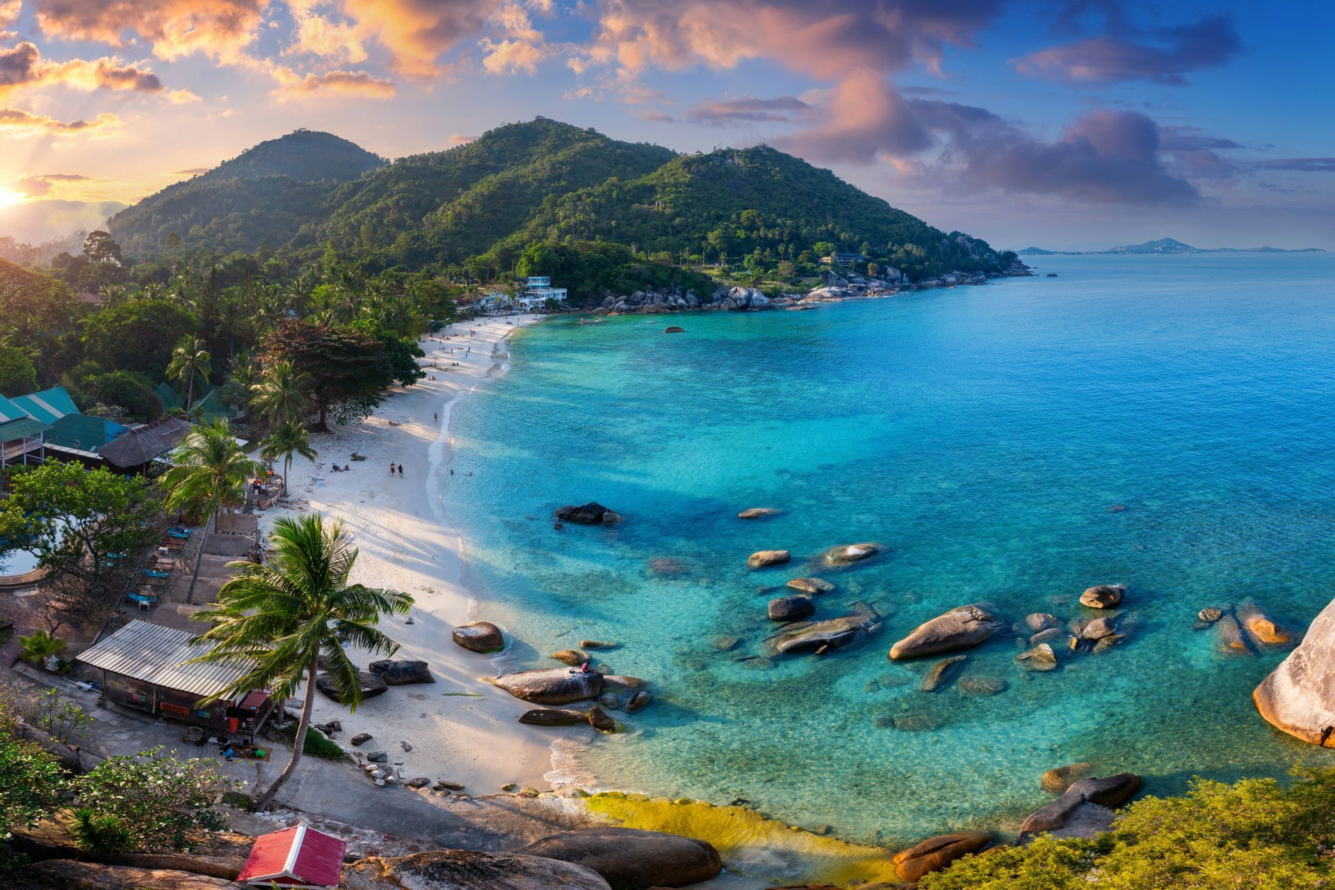 Landscape photo of Jamaica, with a beach and mountains in the background