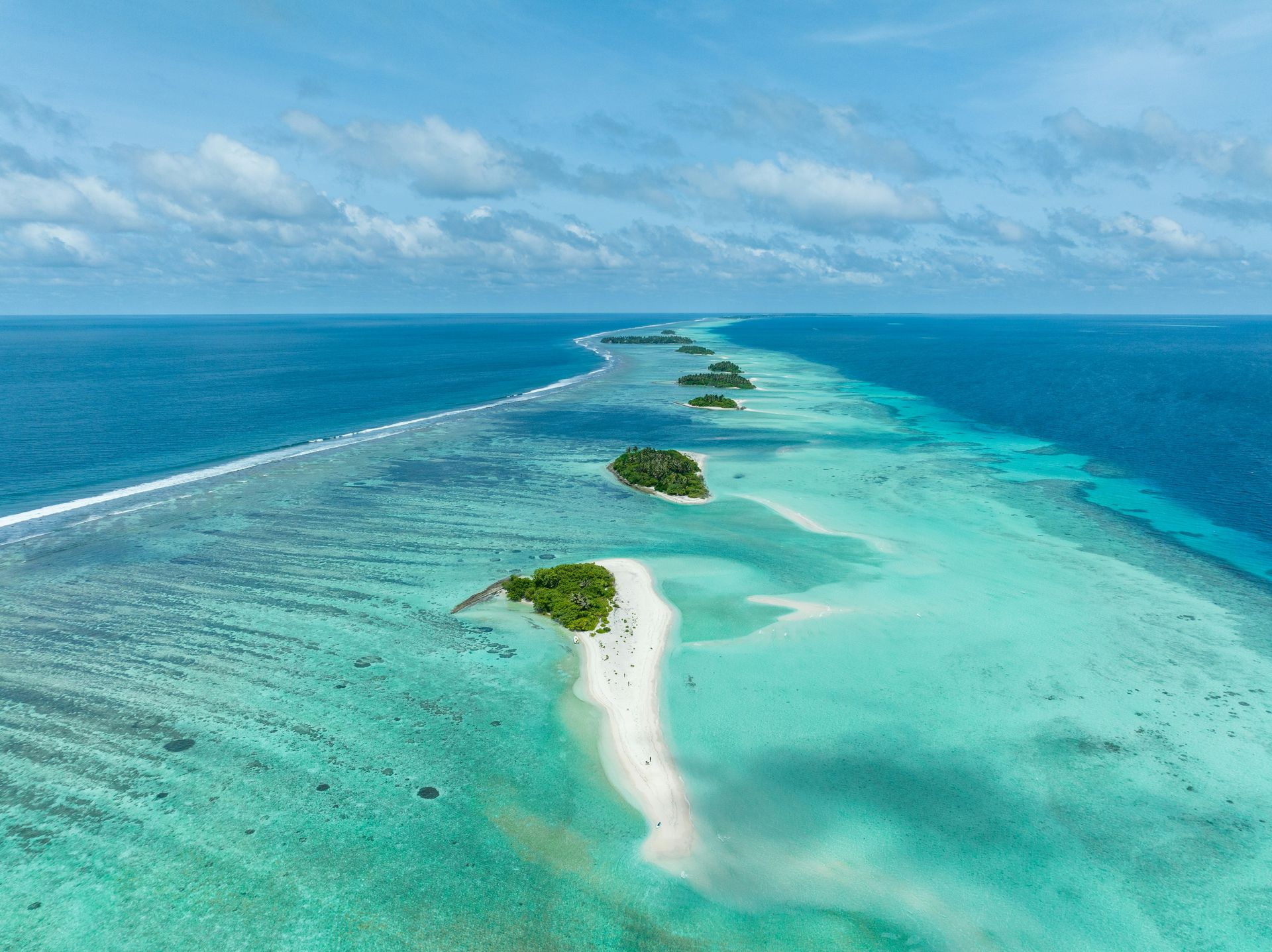 Chain of islands uninhabited in Tha Atoll Maldives.