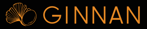 Un logotipo para ginnan con una hoja de ginkgo sobre un fondo negro.
