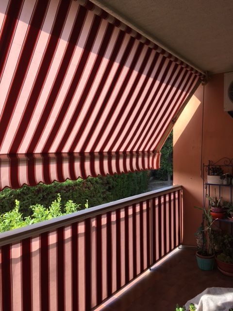 Pose de store banne sur balcon