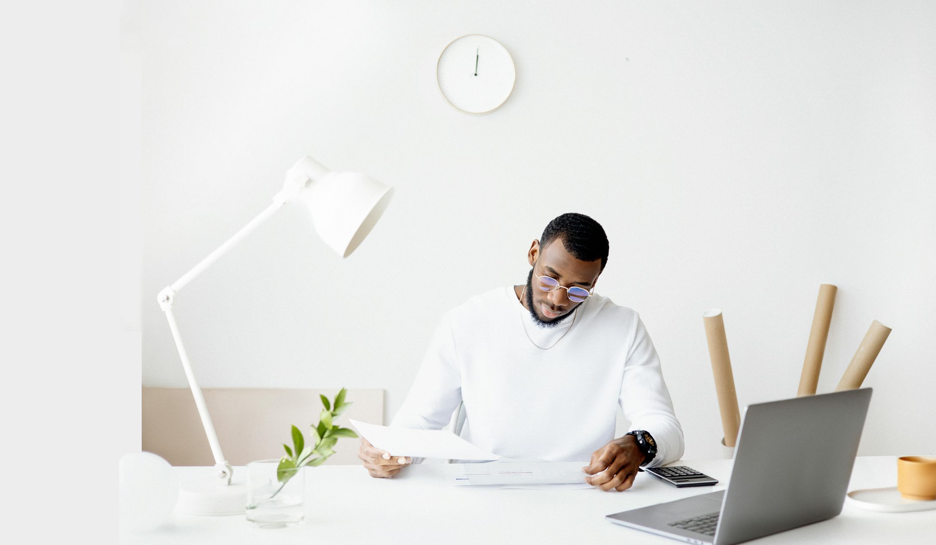 Accountant working at his desk reading papers