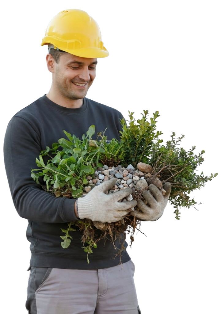 Un artisan souriant tient des graviers et des végétaux dans ses bras.