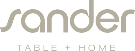 Logo für Sander Table + Home, mit „Sander“ in großen Buchstaben über „TABLE + HOME“.