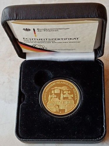 Goldmünze in schwarzem Etui mit Zertifikat der deutschen Münze.