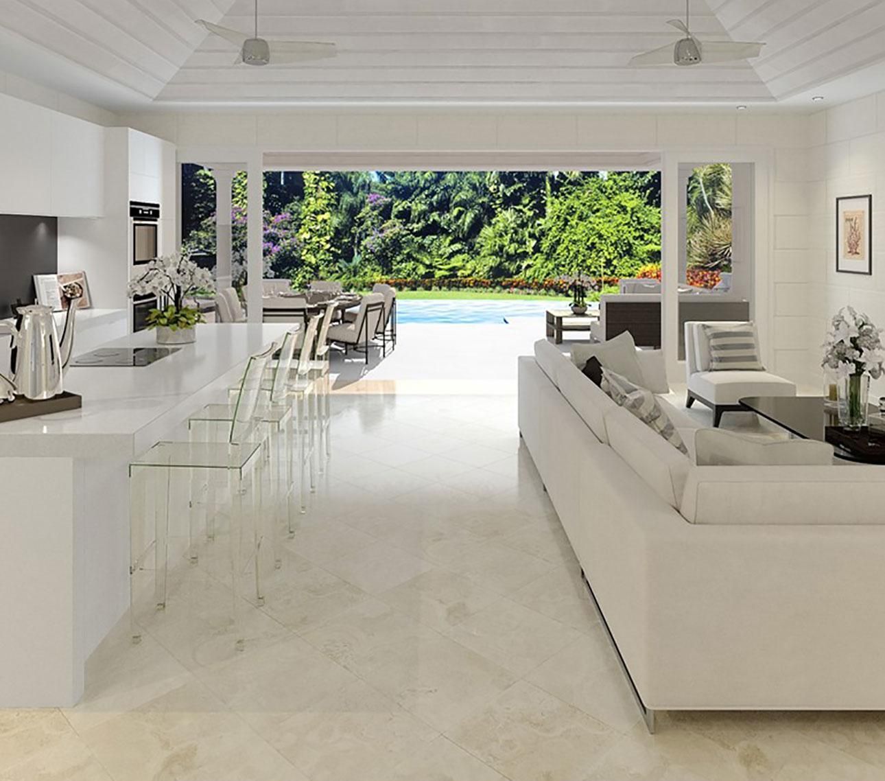 a living room with a couch and a view of a pool