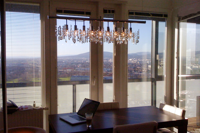 a dining room table with a laptop on it