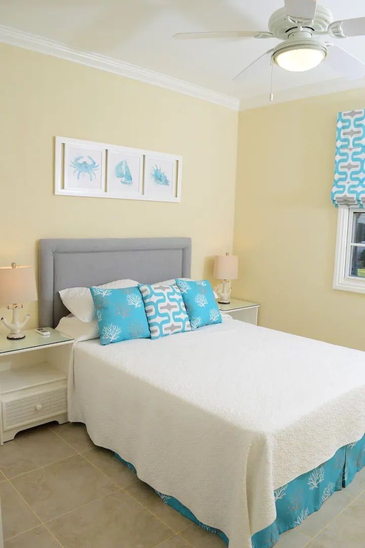 a bedroom with a bed and a ceiling fan .