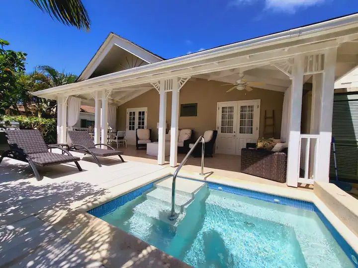 a house with a swimming pool in front of it