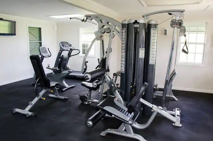 a gym with a lot of exercise equipment in it