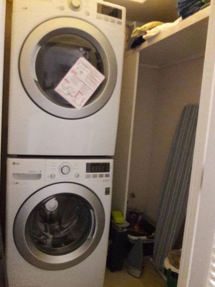 a washer and dryer are stacked on top of each other