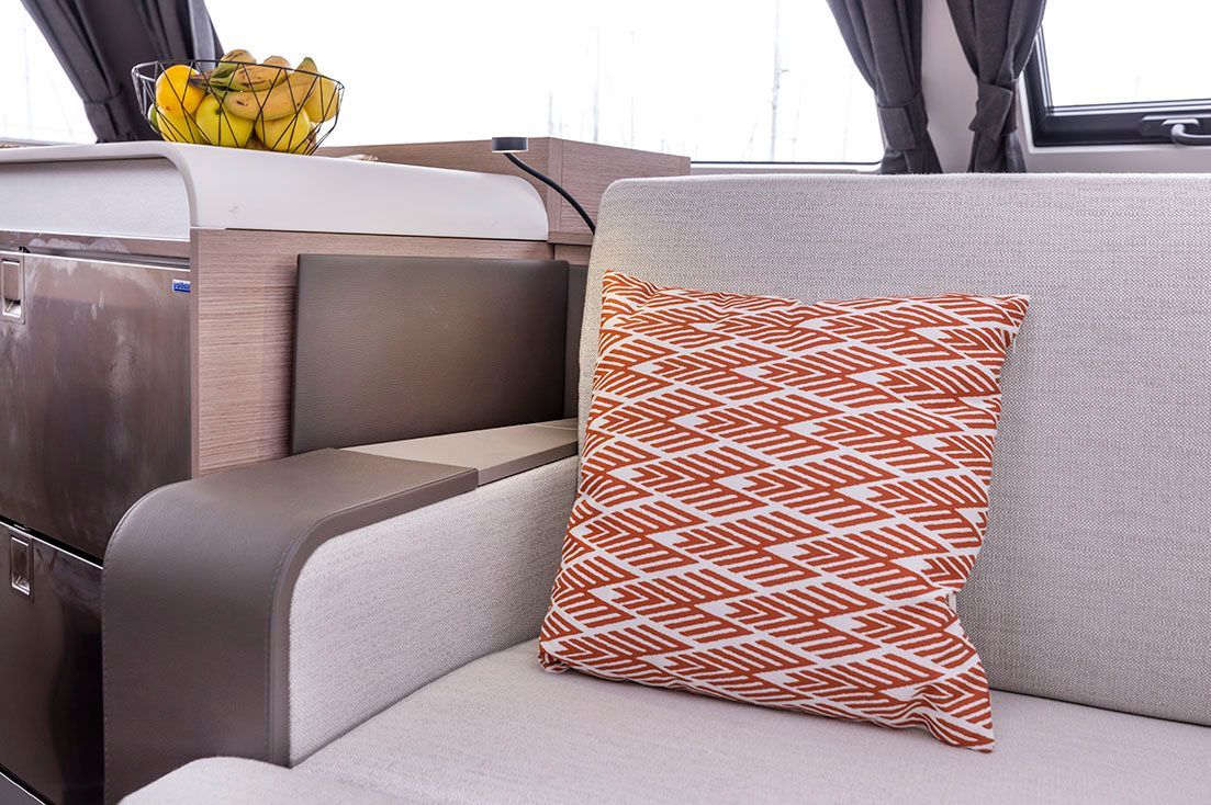 a couch with a pillow on it in a living room