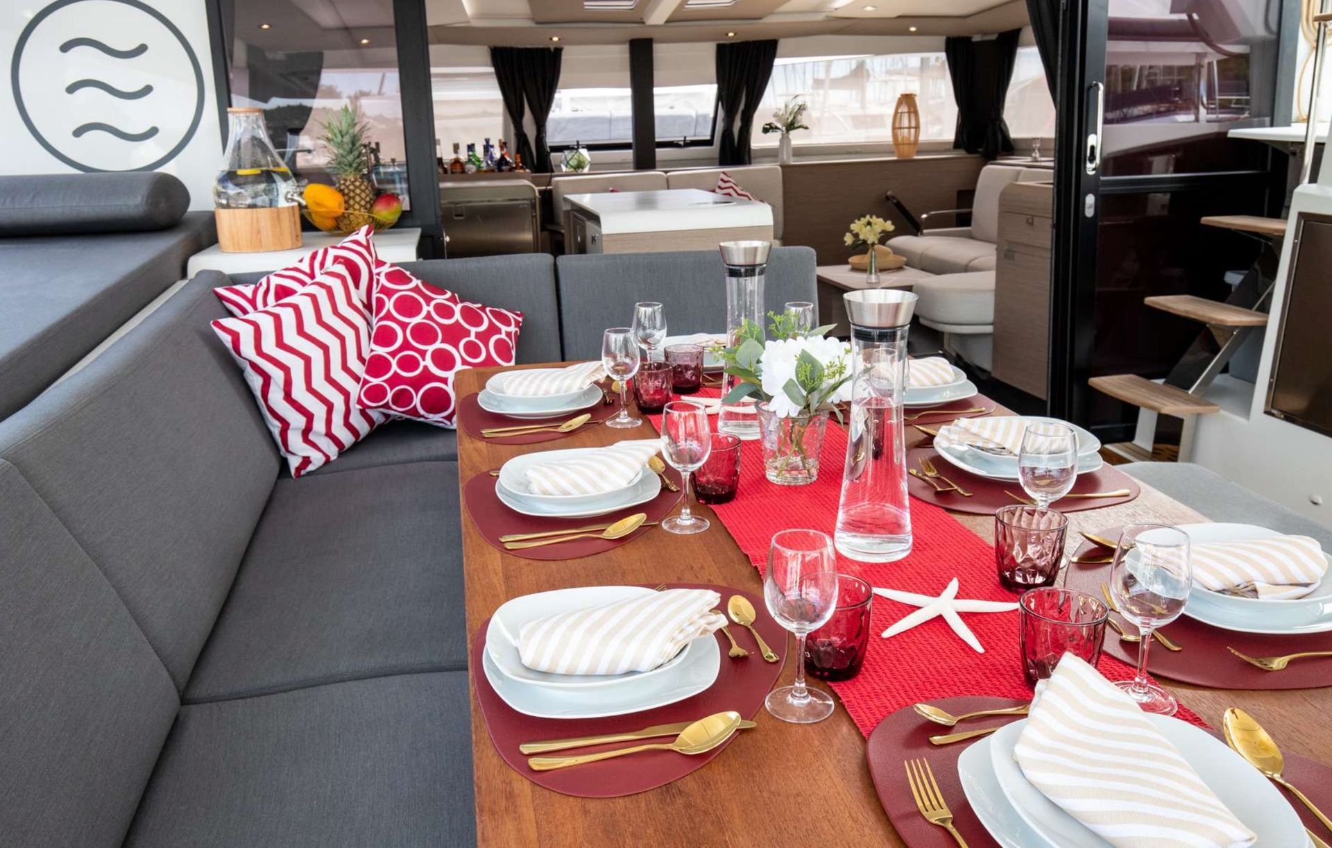 a table with plates, utensils and a starfish on it