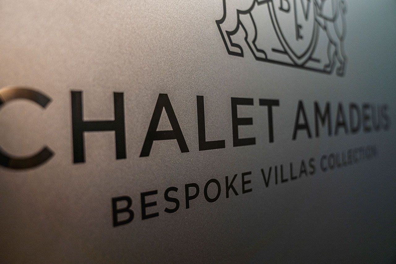 a sign for chalet amadeus bespoke villas collection