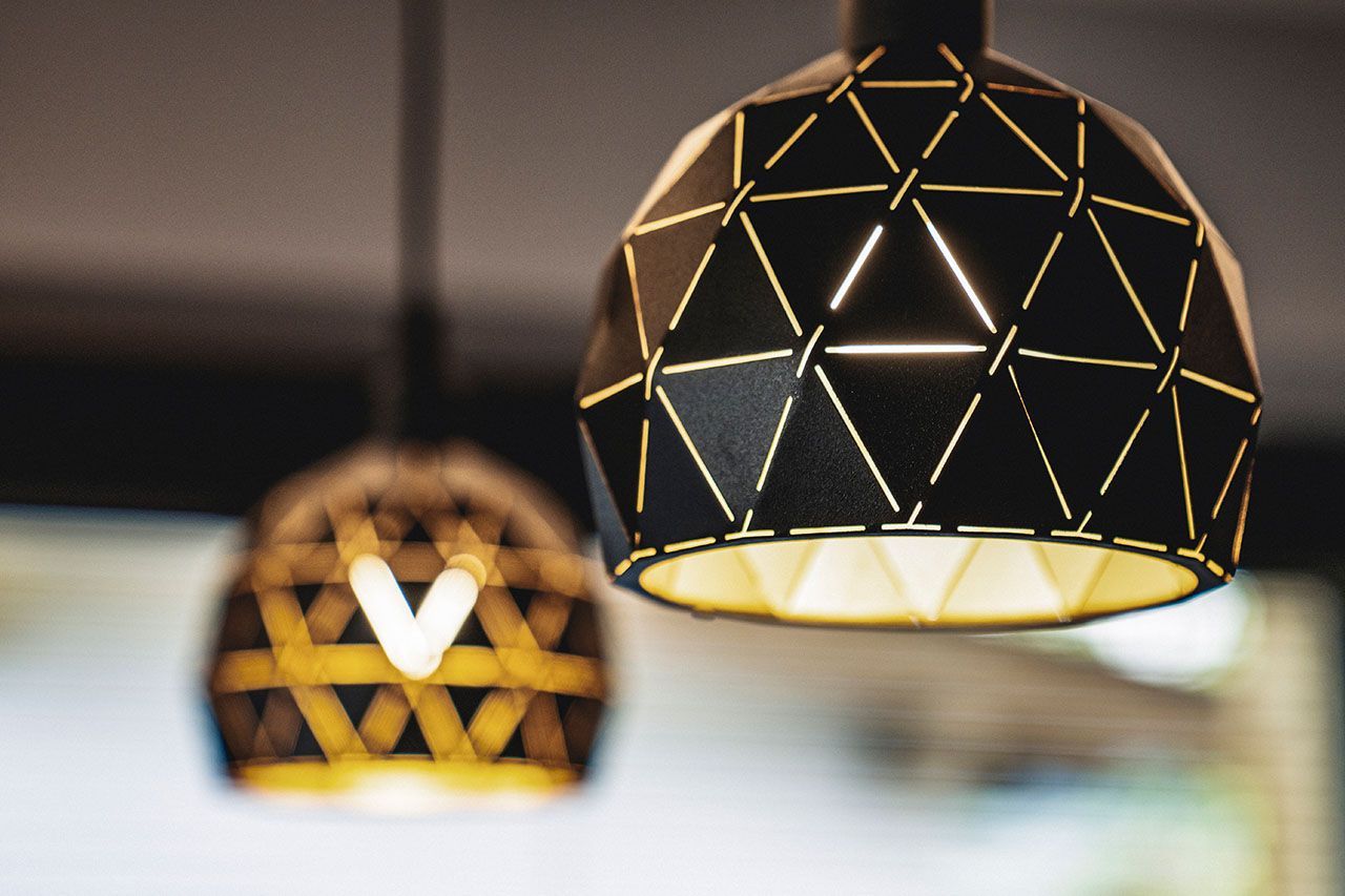 a close up of two lamps hanging from the ceiling