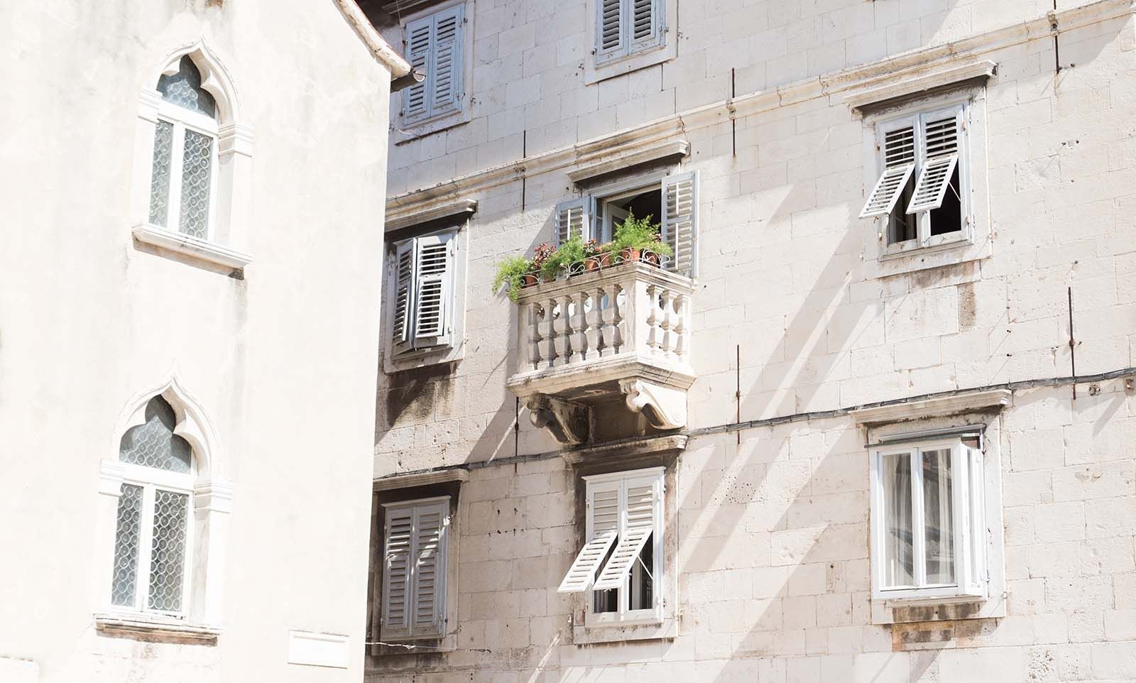 a building with a balcony on the side of it