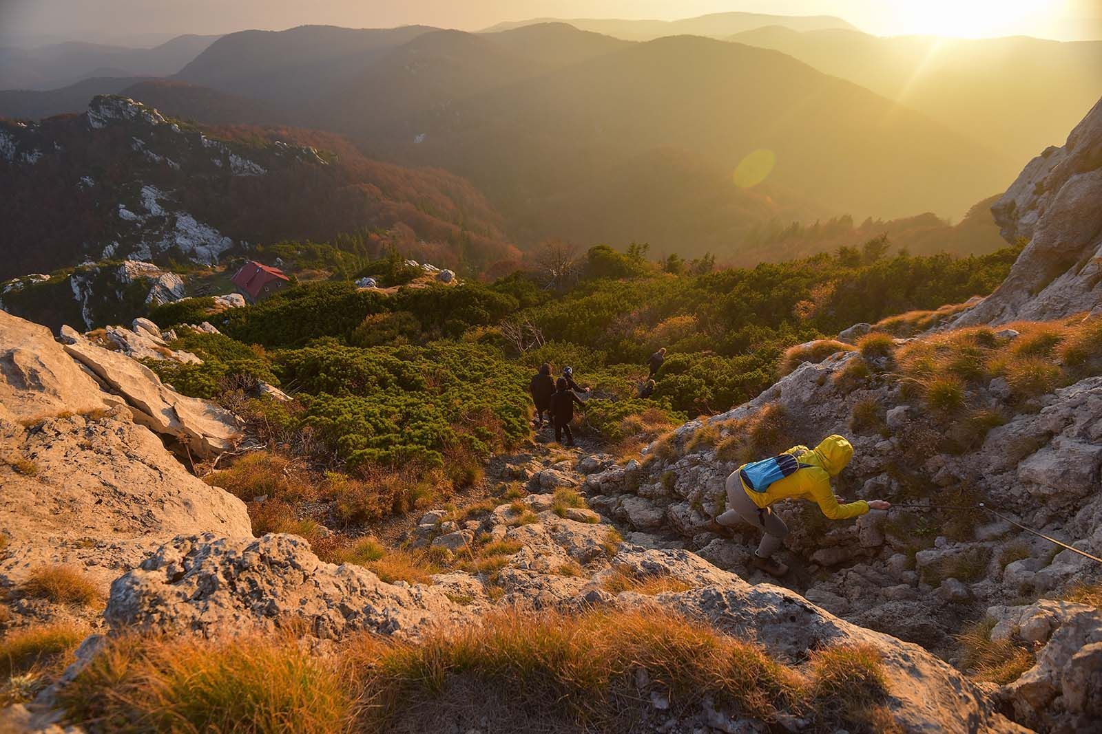 a person is laying on top of a rocky mountain