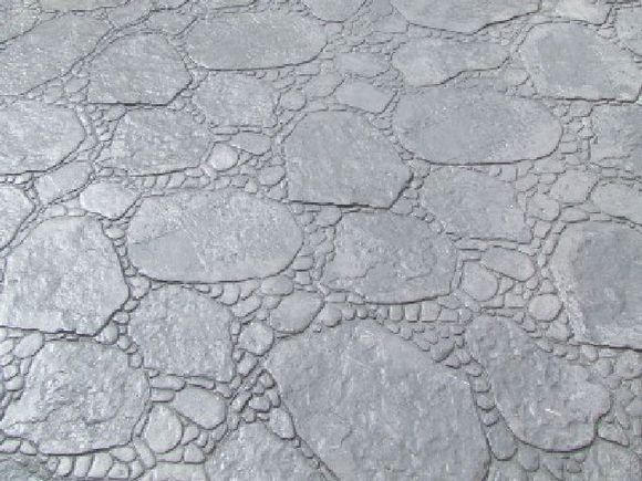 Un primer plano de un suelo de piedra gris.
