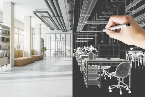Eine Person zeichnet mit einem Stift ein 3D-Modell eines Büros .