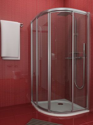 Un baño con azulejos rojos y una cabina de ducha curva.