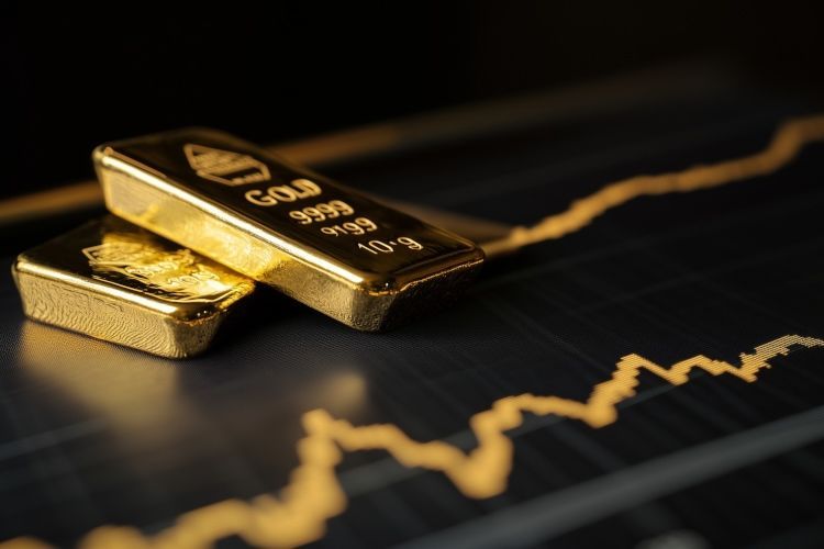 Zwei Goldbarren für den Goldankauf liegen übereinander auf einem schwarzen Untergrund