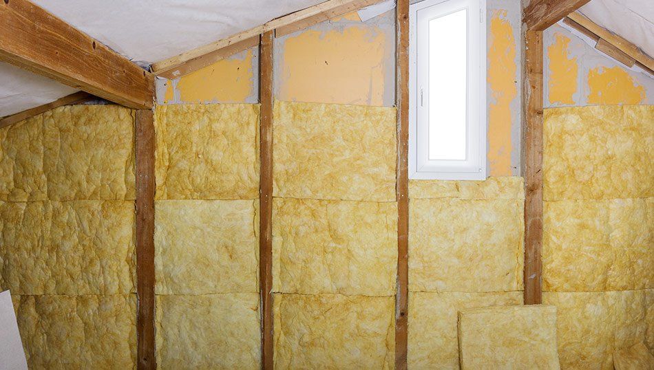 Pause de panneaux d'isolation de type laine de verre