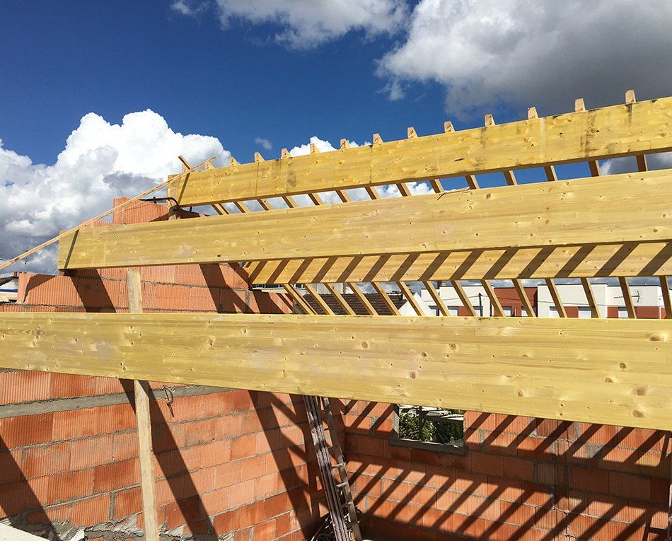 Réalisation de charpente industrielle en bois par la société Noirot Toiture