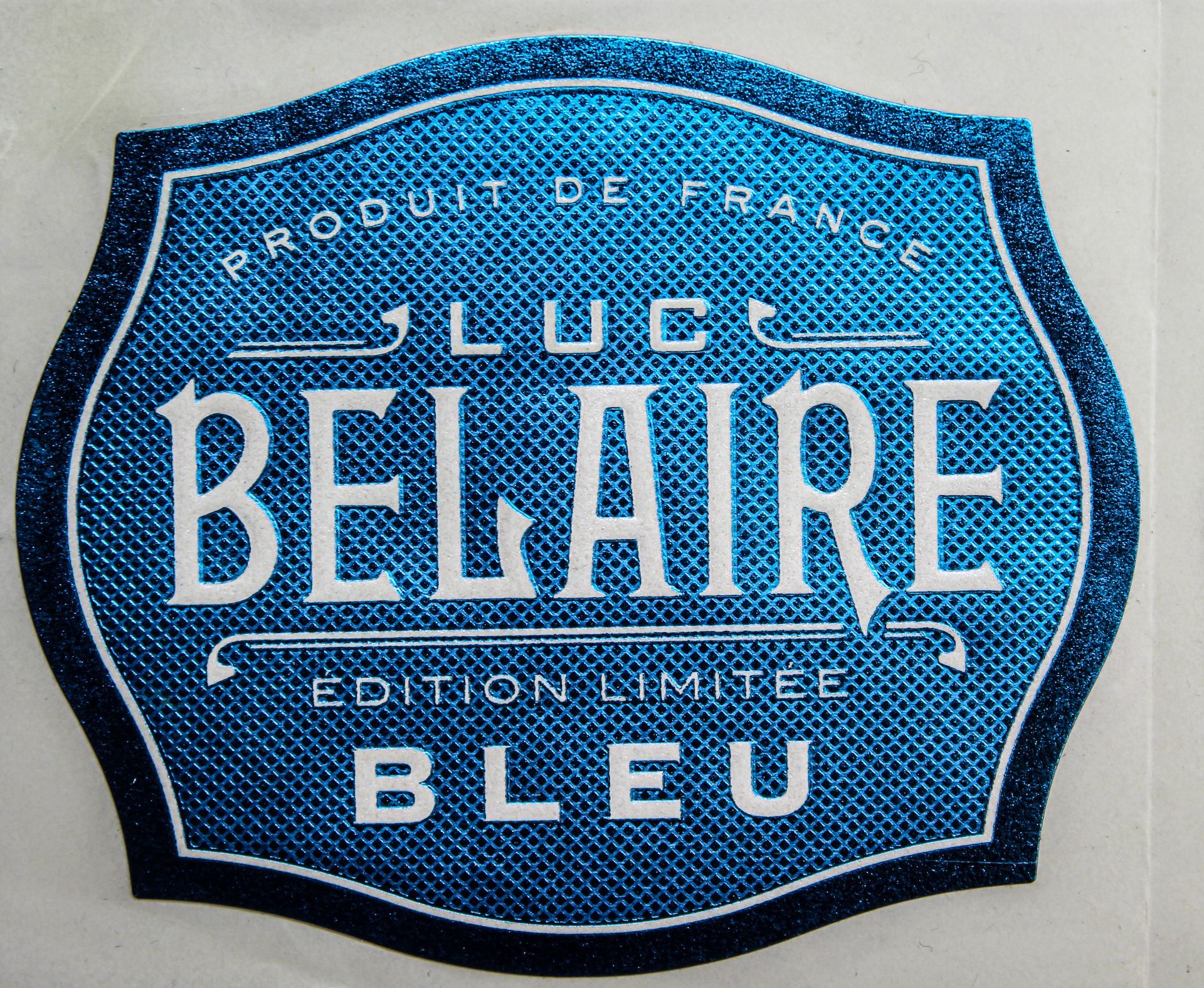Logo en laiton Luc Belaire
