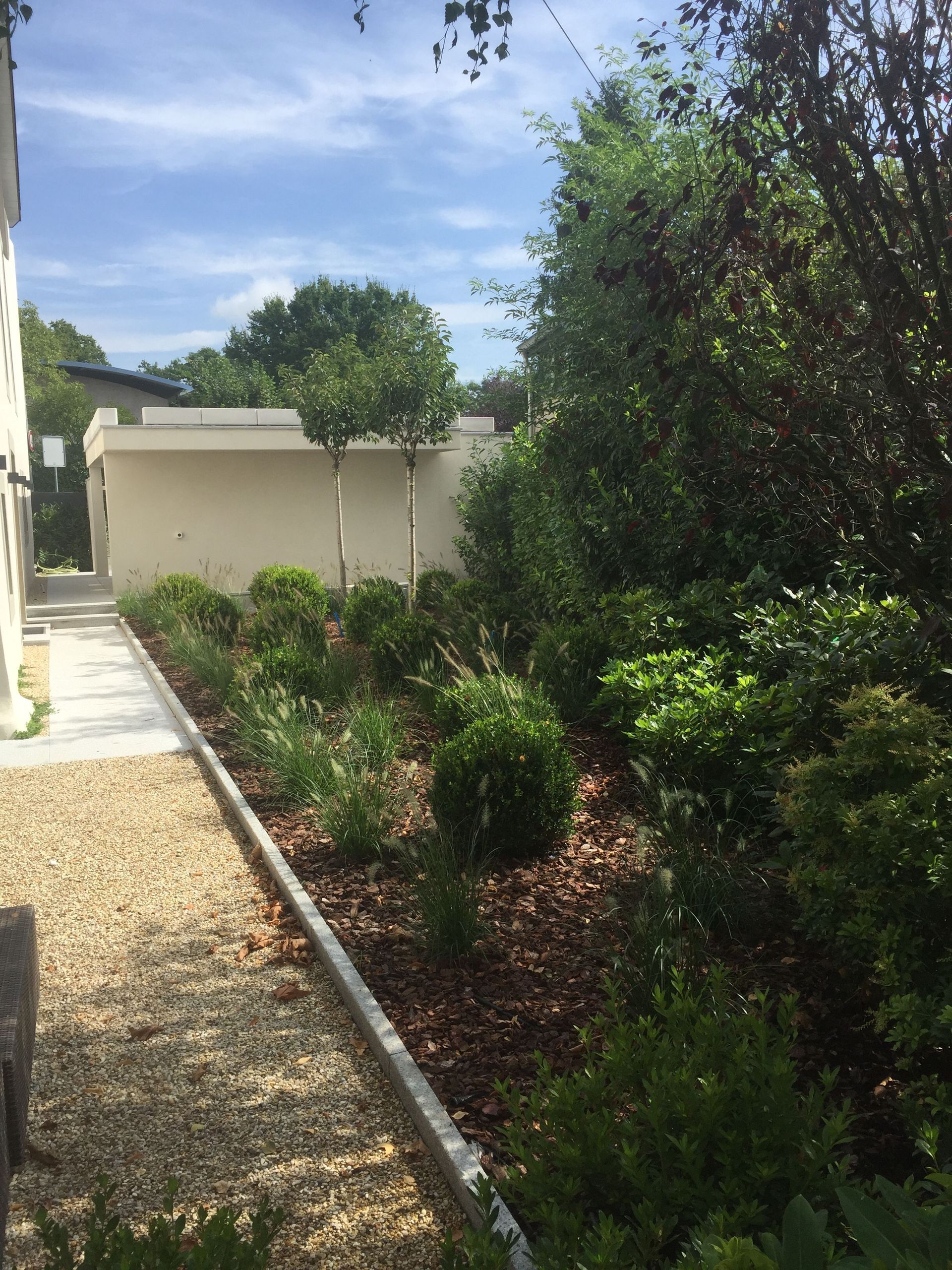 Aménagements extérieurs dans un corps de ferme - Ideal Constructions Suisse SA - Vésenaz
