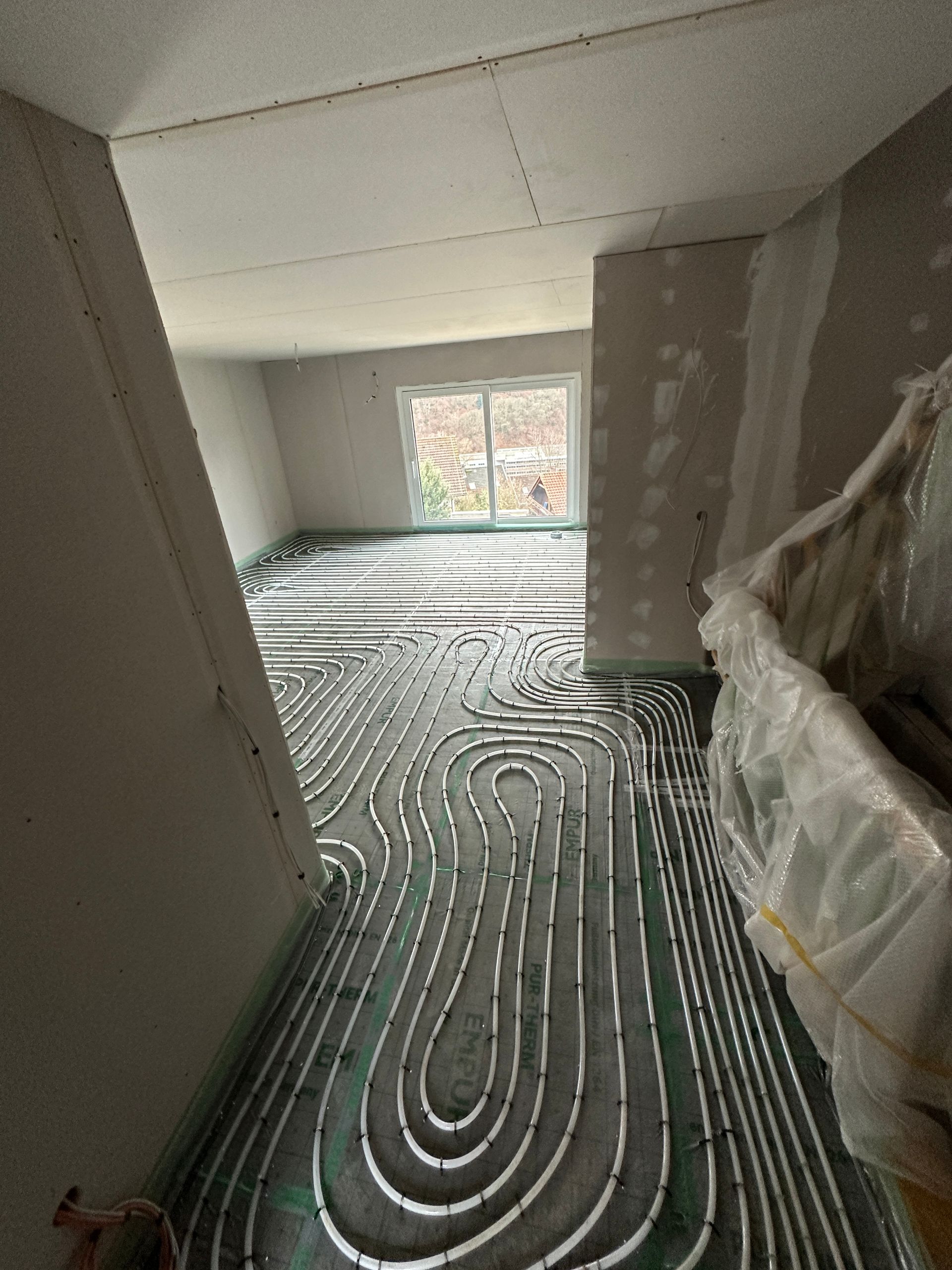 Fußbodenheizung mit Trockenbauwänden im Neubau