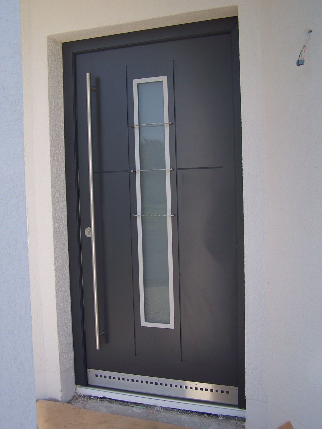 Graue Haustür, Kleber Hausbau