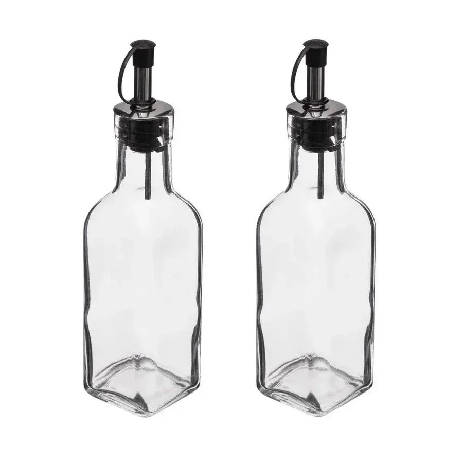 Dos botellas de vidrio transparente con tapas negras sobre fondo blanco.