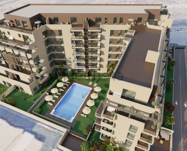 Complejo de apartamentos con piscina, fachada color canela, balcones y azoteas planas.