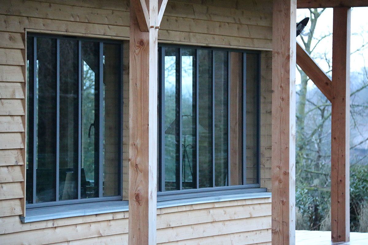 Maison ossature bois avec fenêtre en cadre aluminium