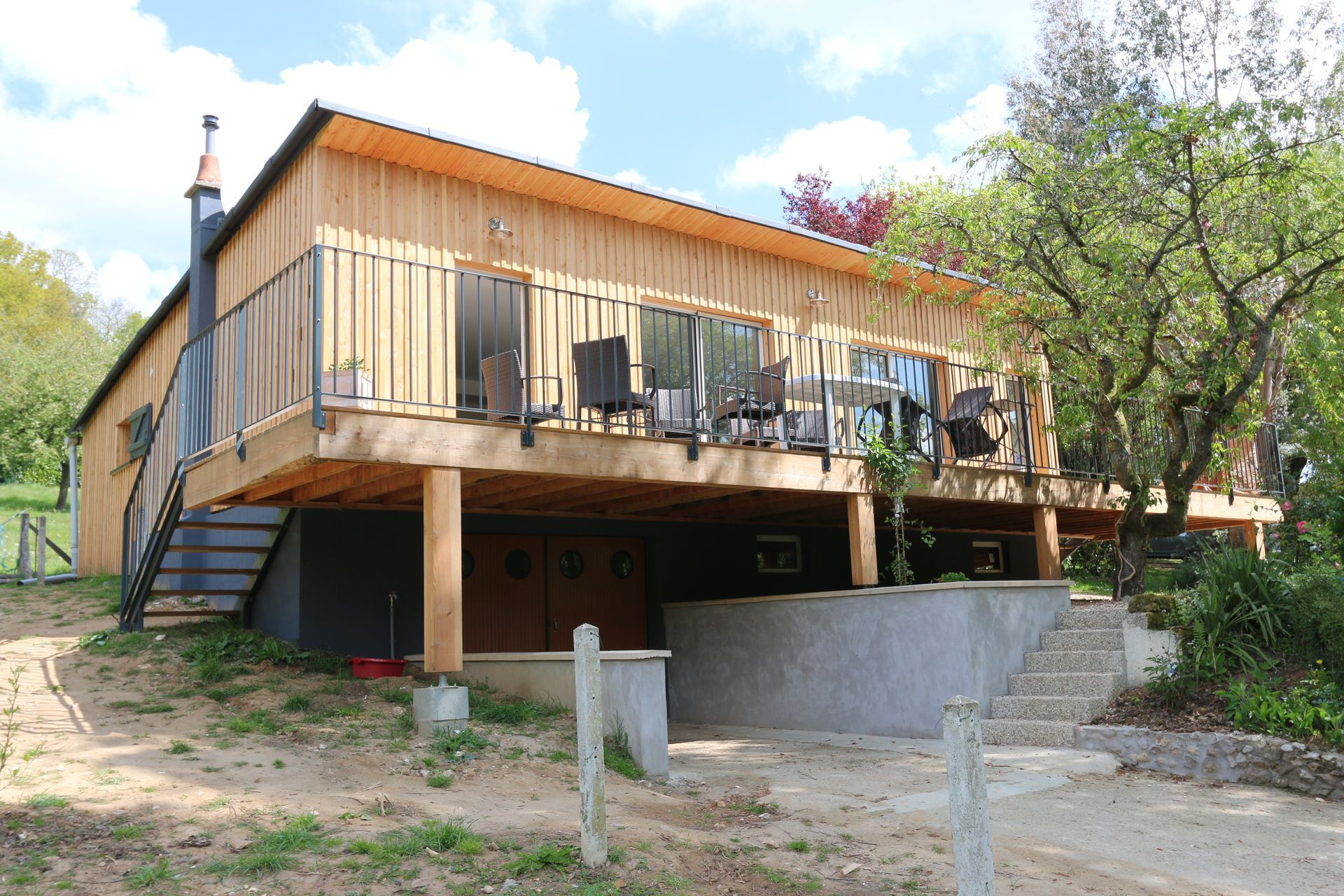 Maison avec terrasse à ossature en bois