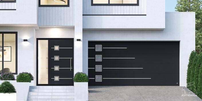 Una casa bianca con una porta del garage nera