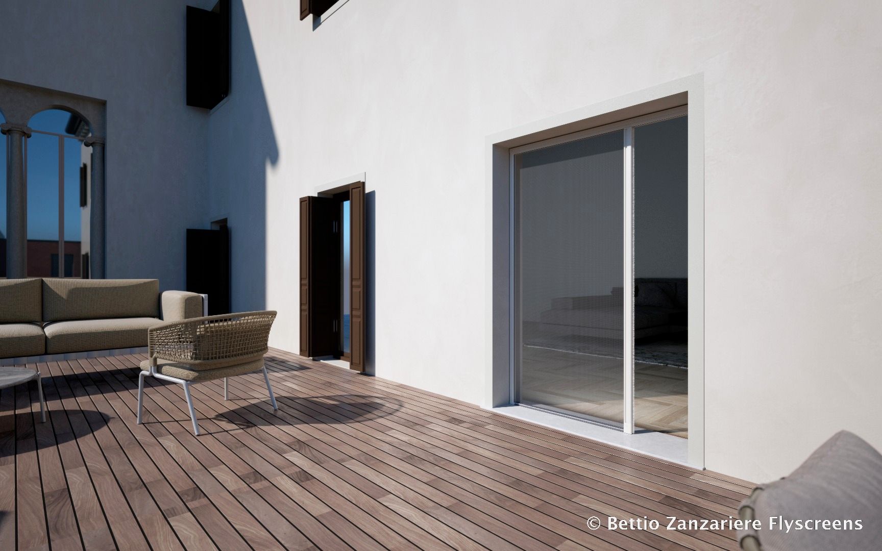 Un edificio bianco con un ponte di legno di fronte