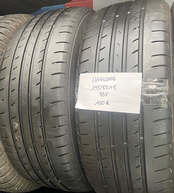 Dos neumáticos están apilados uno encima del otro con un cartel que dice linglong