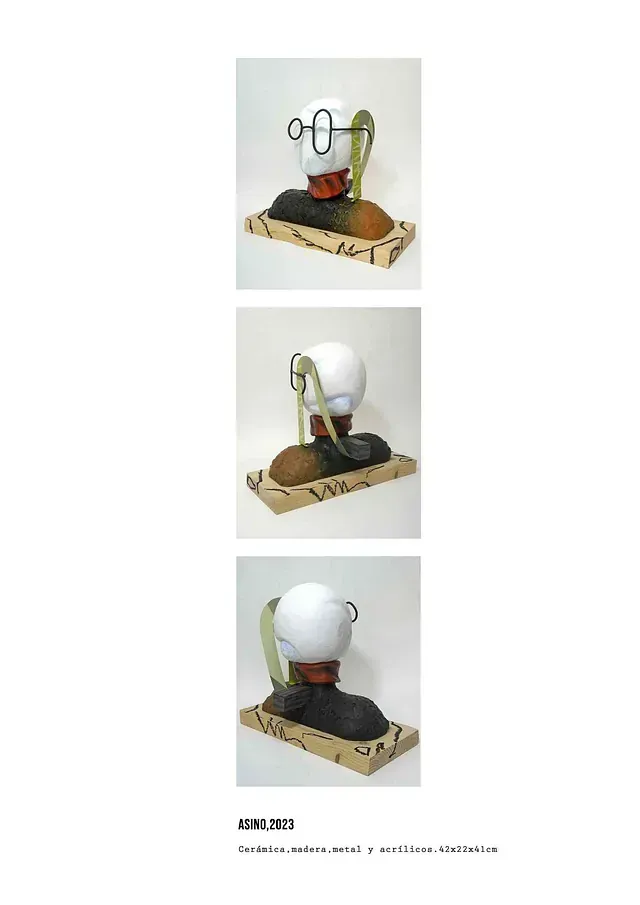 Una escultura de la cabeza de una persona con gafas.