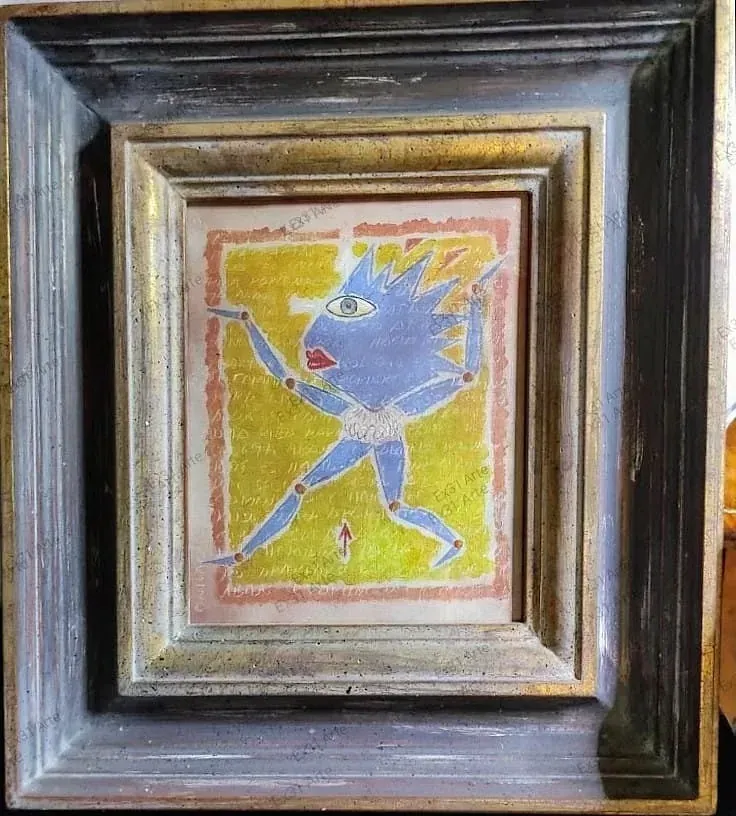 Un cuadro de un monstruo azul en un marco dorado.