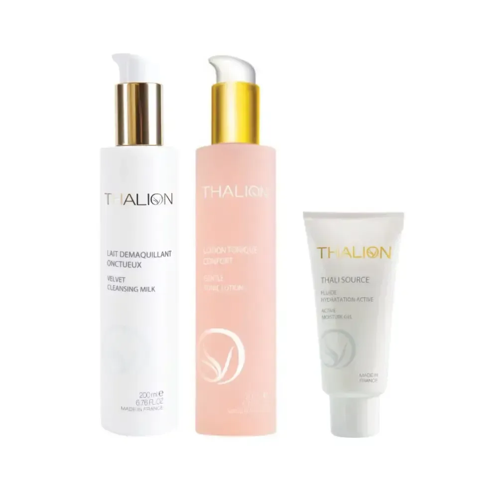 Trois bouteilles de cosmétiques Thalign sur fond blanc