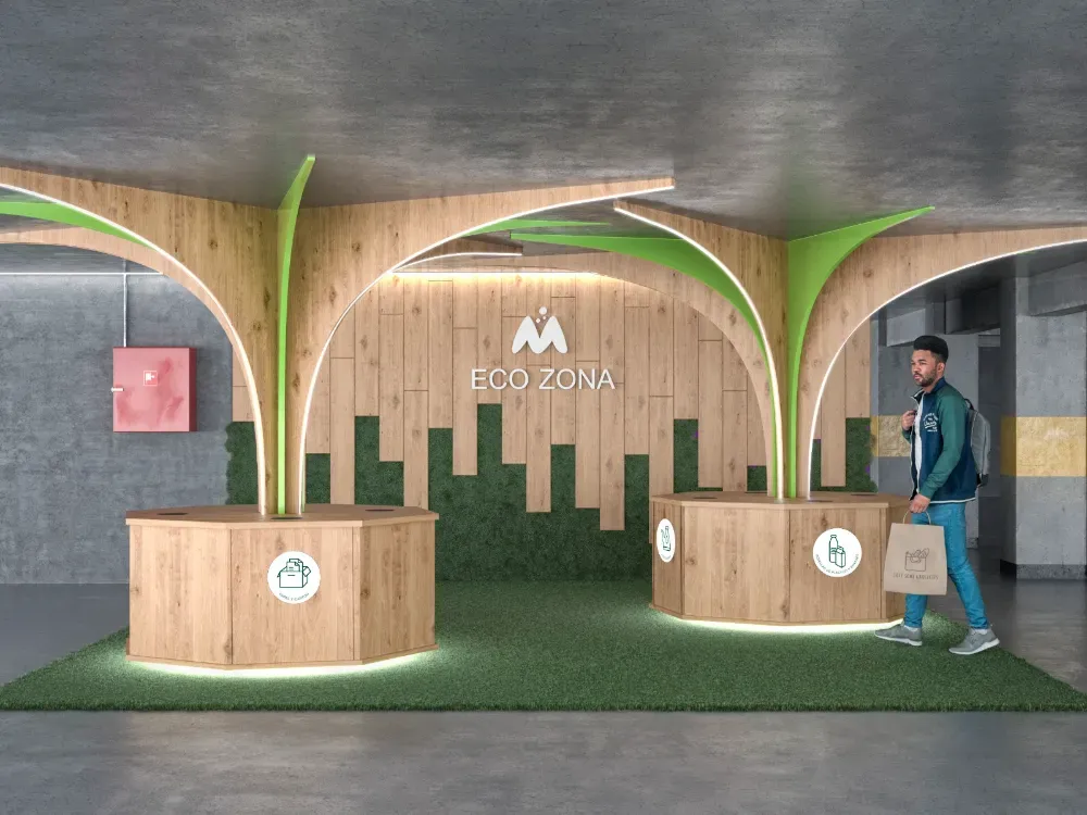 Un área de recepción tipo “Eco Zone” con estructuras de madera, detalles verdes y una persona caminando.