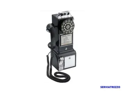 Un teléfono negro está sobre una superficie blanca.