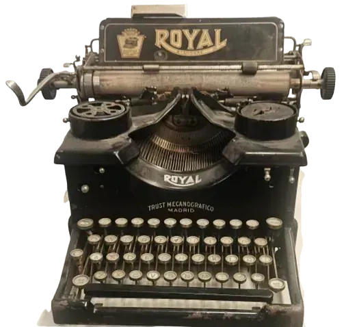 Una vieja máquina de escribir real está sobre una mesa.